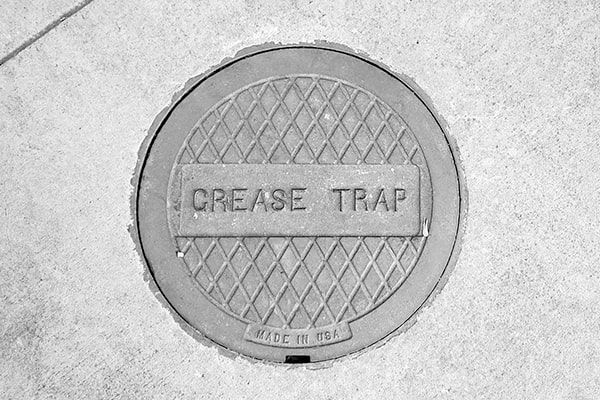 during grease trap pumping, a vacuum truck will remove the accumulated grease and solids from your grease trap